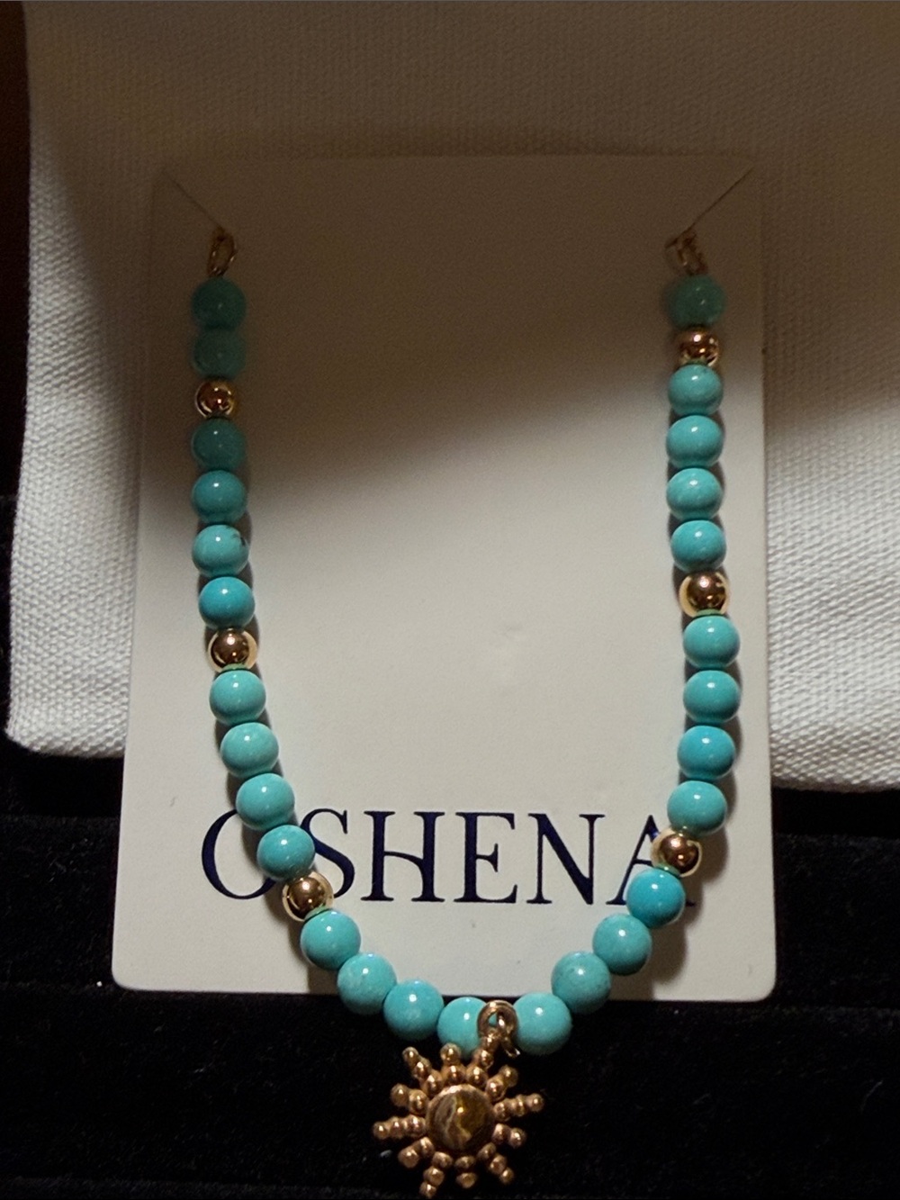 Turquoise Bead Necklace with Gold Sun Pendant